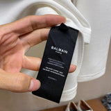 Close-up of Balmain designer clothing craftsmanship