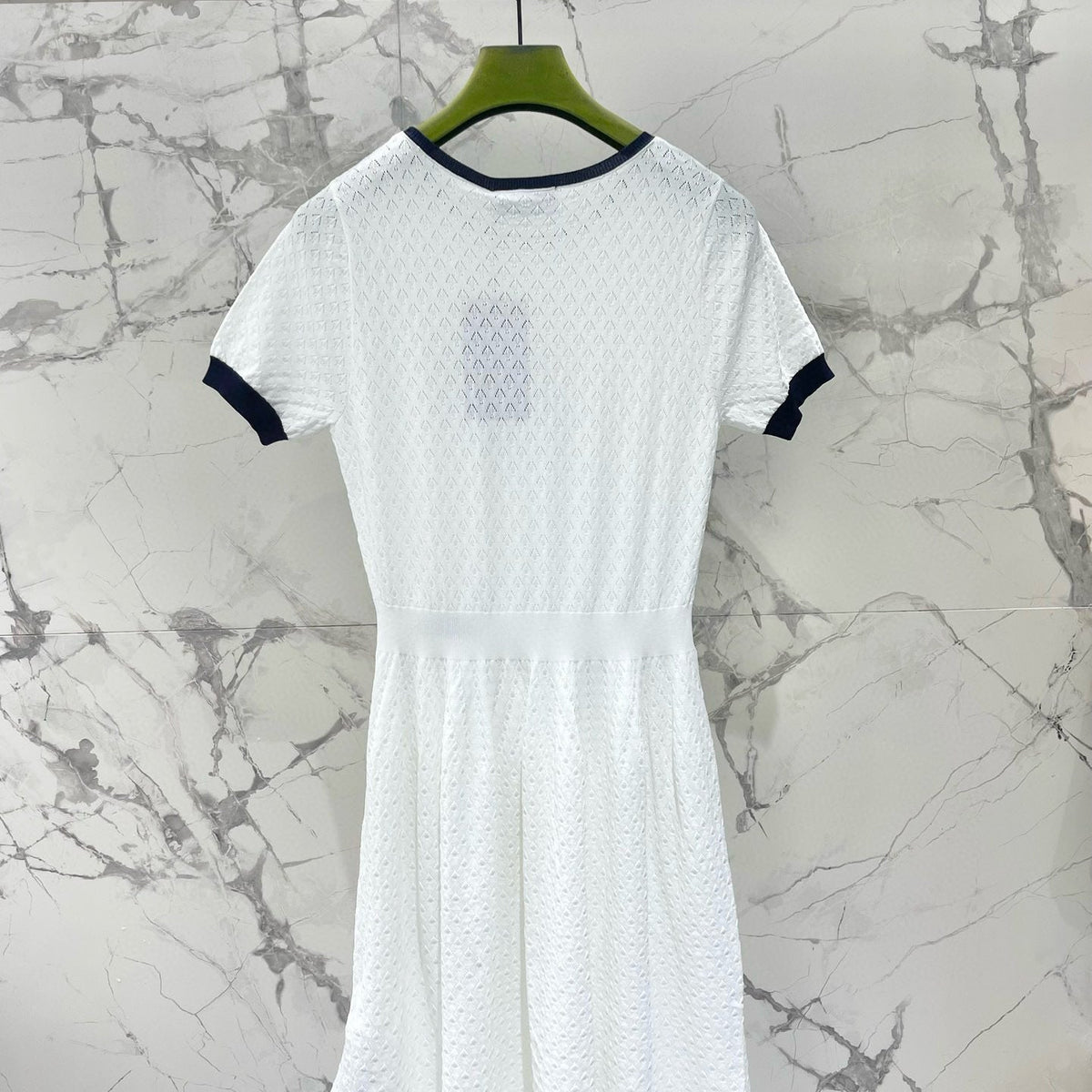 Gucci Dress flat lay on neutral background