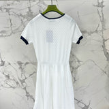 Gucci Dress flat lay on neutral background