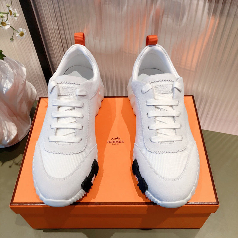 Hermès White High-Top Sneakers - Angled View