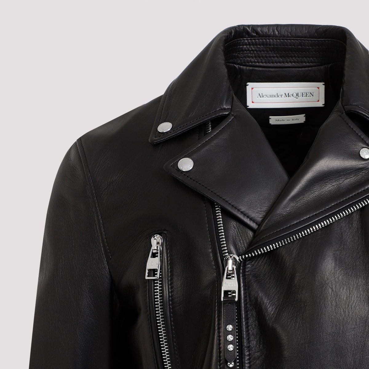 Close-up of Alexander McQueen jackets hardware and fine stitching