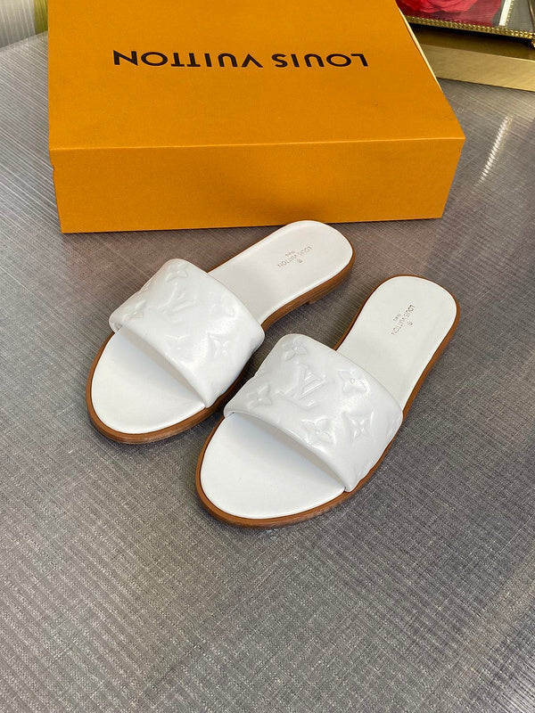 Louis Vuitton White Loafer Flats - Close-Up Texture View