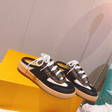 Louis Vuitton Black Pointed-Toe Flats - Angled View