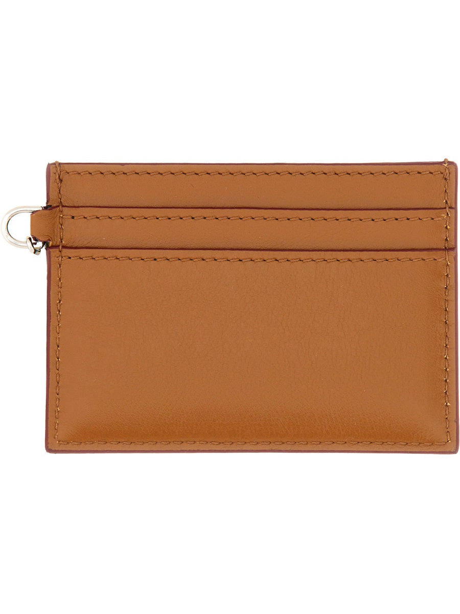 Close-up of Alexander McQueen wallets hardware and fine stitching