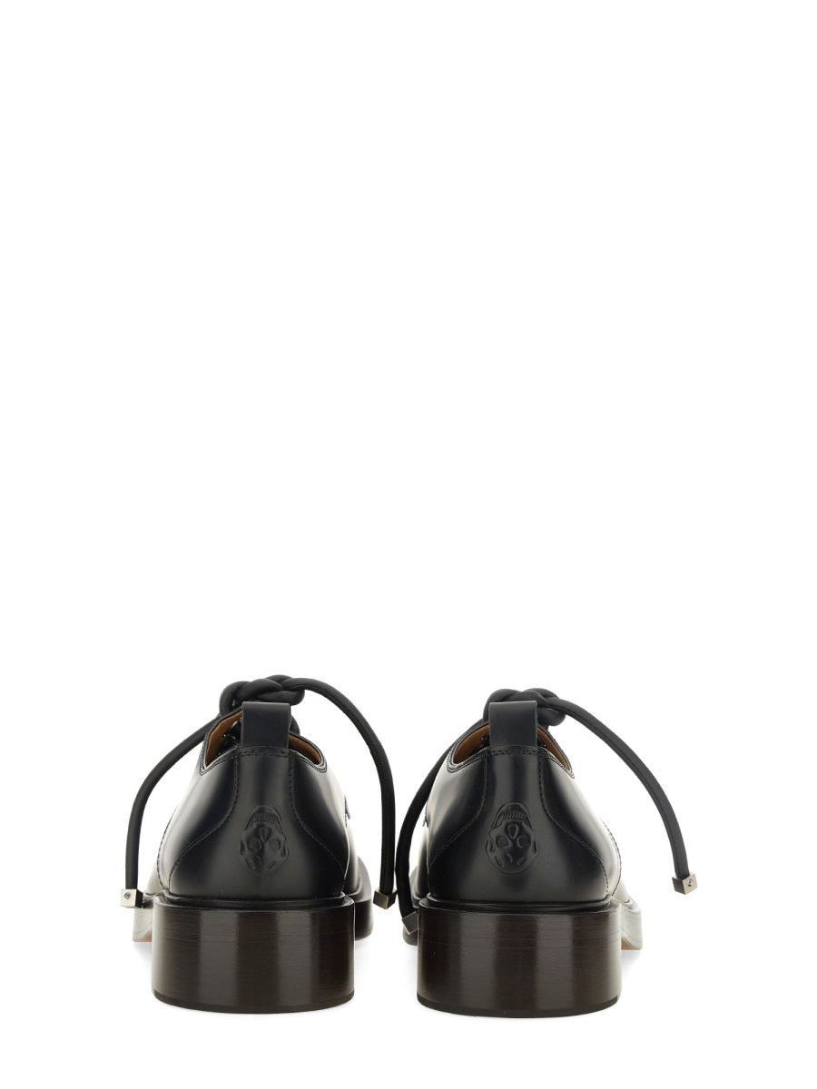 Alexander McQueen athletic side profile designer luxury fashion