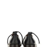 Alexander McQueen athletic side profile designer luxury fashion