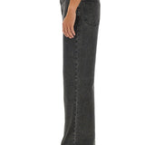 Close-up of Alexander McQueen pants hardware and fine stitching