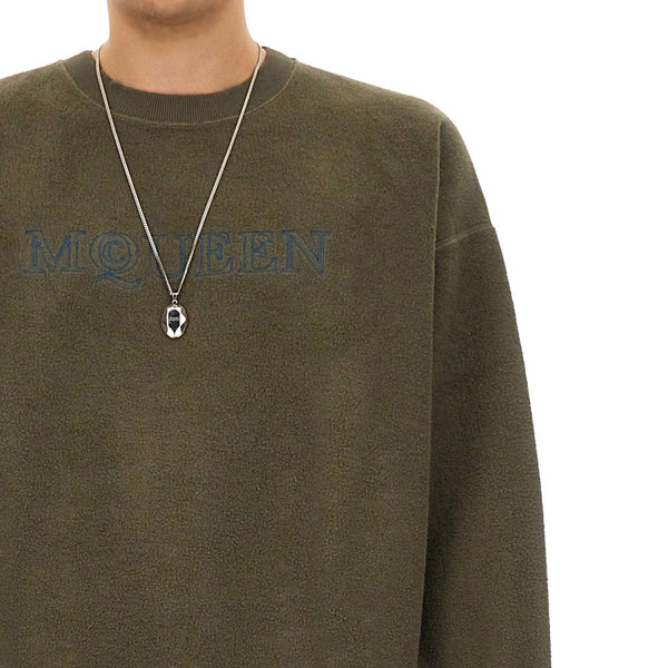 Close-up of Alexander McQueen sweaters & pullovers hardware and fine stitching