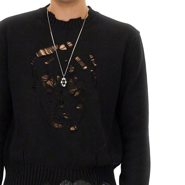Close-up of Alexander McQueen sweaters & pullovers hardware and fine stitching