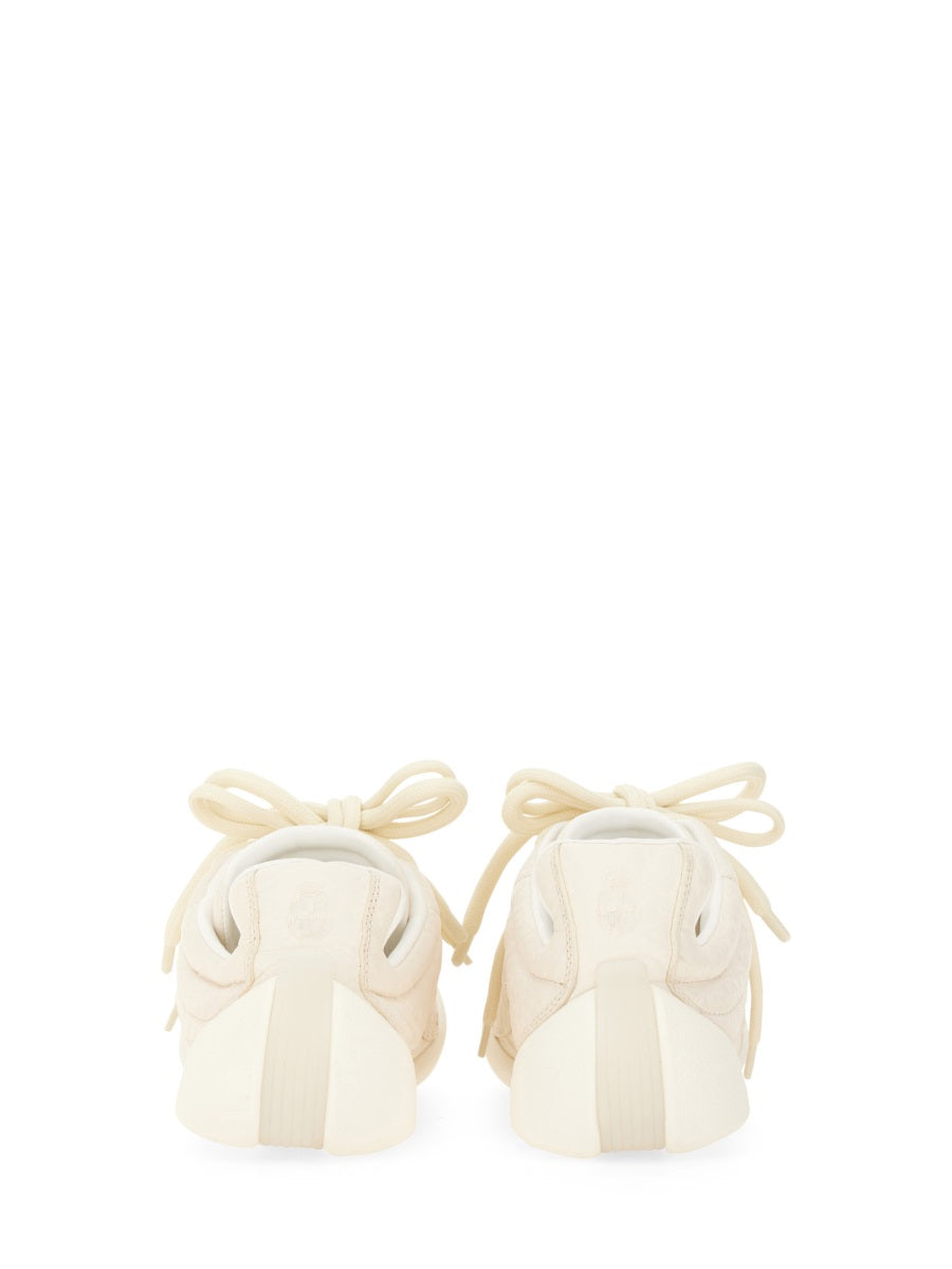 Alexander McQueen athletic side profile designer luxury fashion