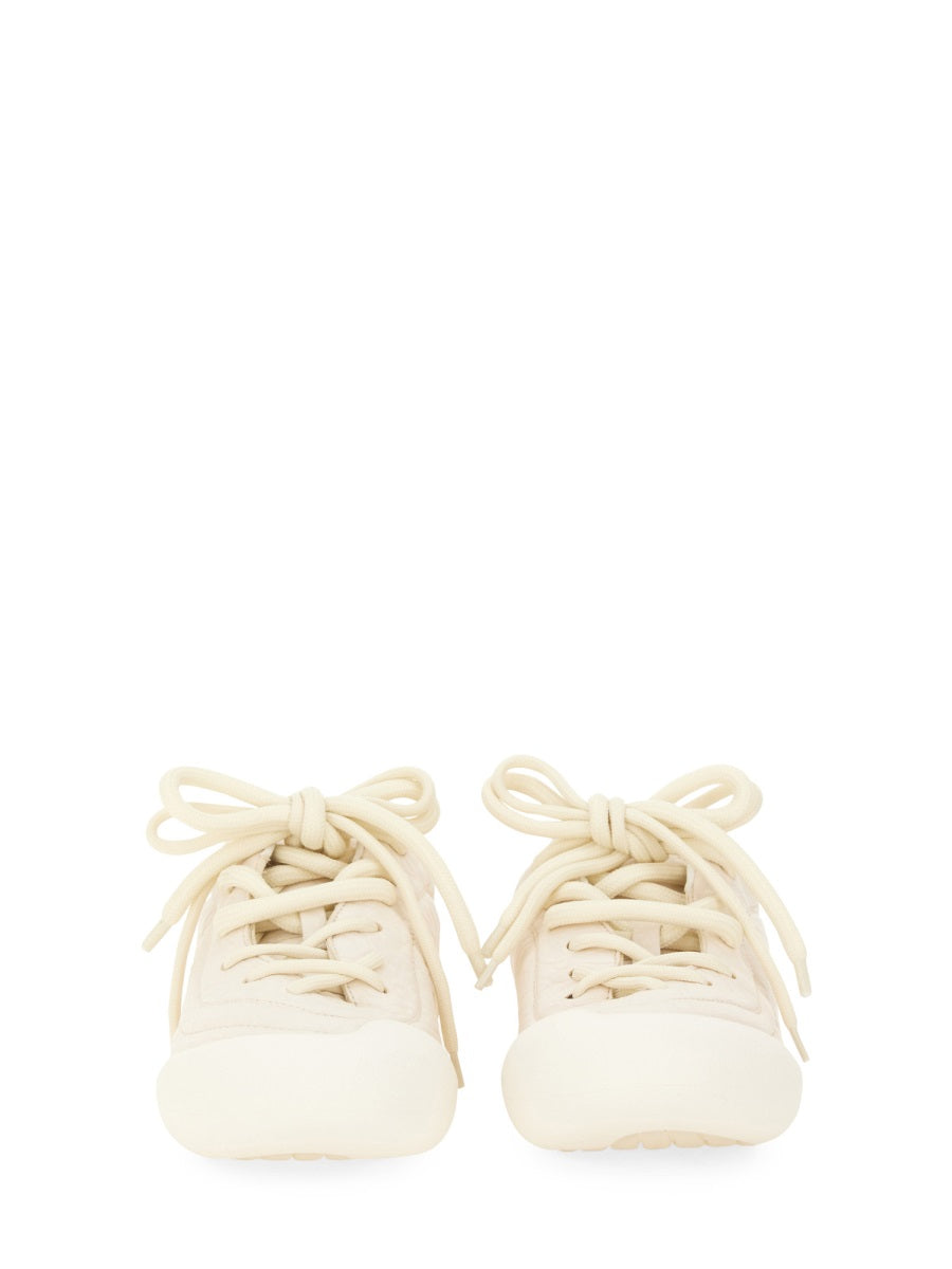 Close-up of Alexander McQueen athletic hardware and fine stitching