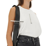Close-up of Alexander McQueen tee shirts hardware and fine stitching