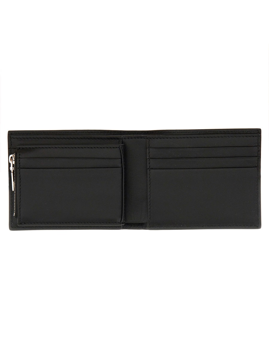 Close-up of Alexander McQueen wallets hardware and fine stitching