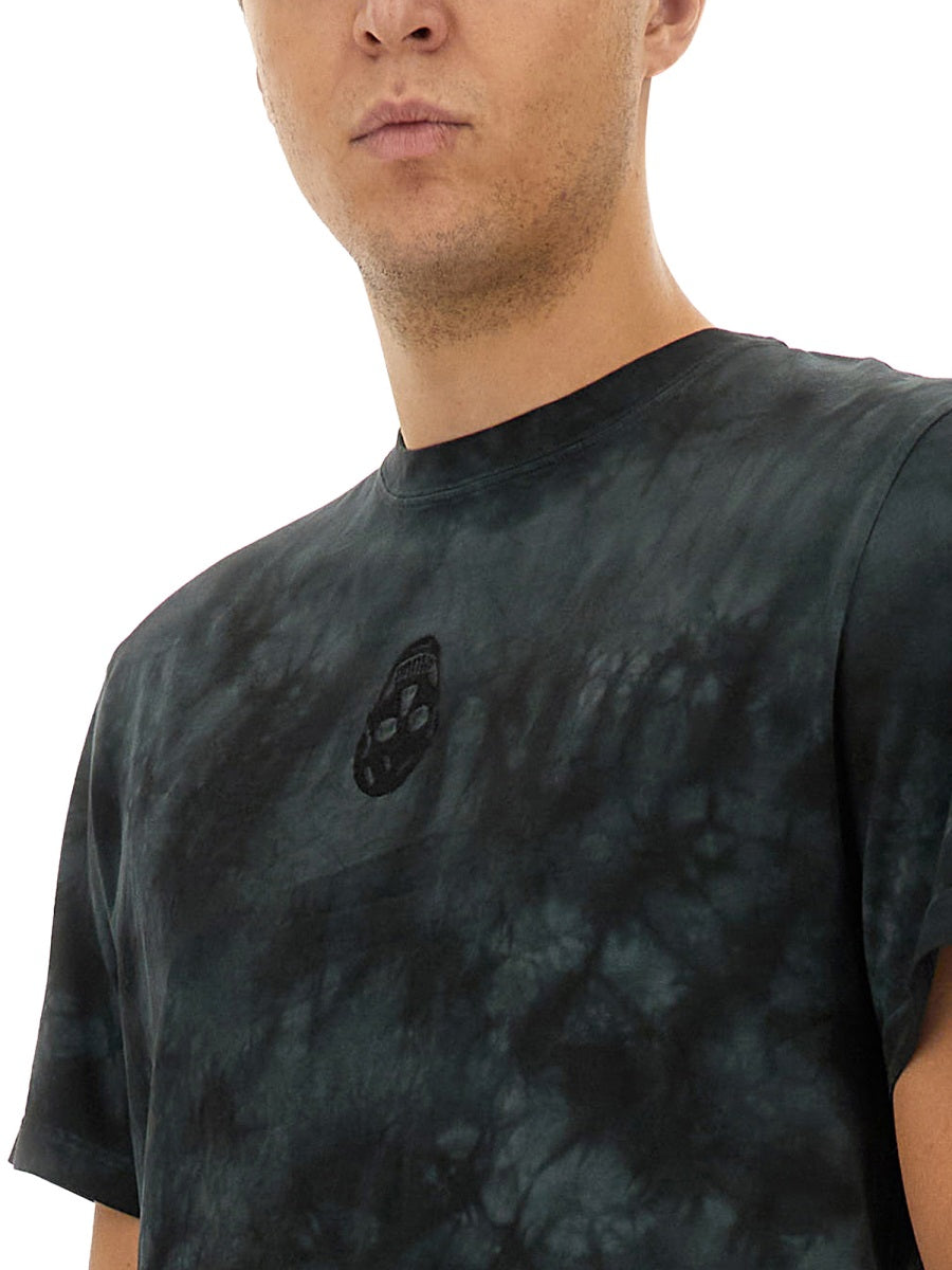 Close-up of Alexander McQueen tee shirts hardware and fine stitching