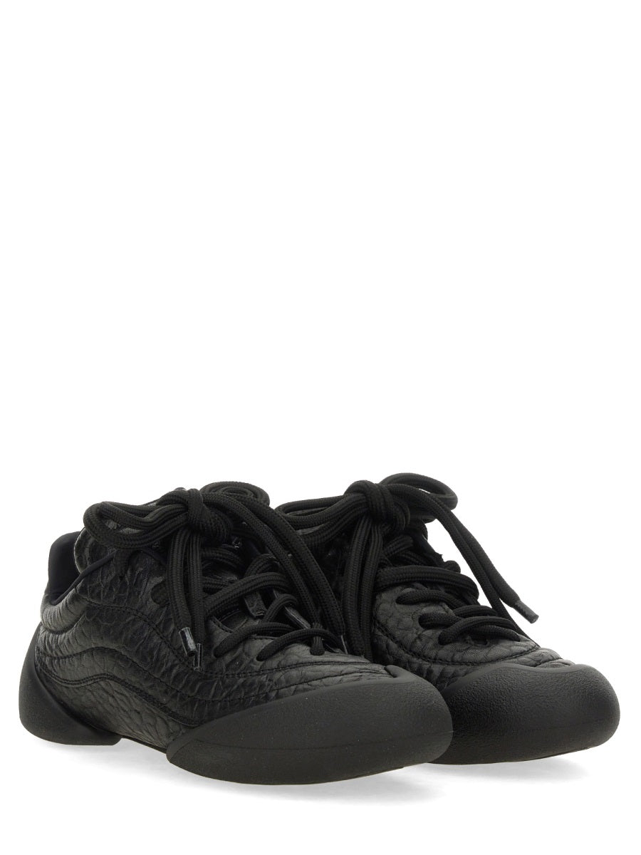Alexander McQueen athletic side profile designer luxury fashion