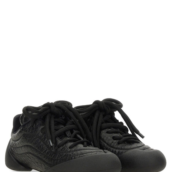 Alexander McQueen athletic side profile designer luxury fashion