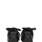 Close-up of Alexander McQueen athletic hardware and fine stitching