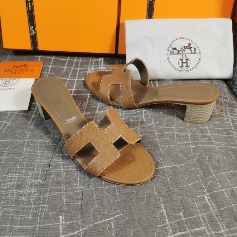 Hermès White Flat Thong Sandals - Angled View