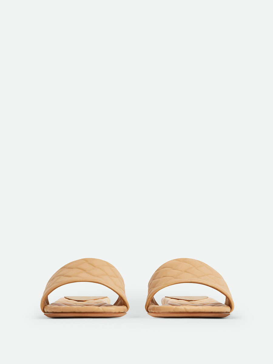Close-up of Bottega Veneta flats hardware and fine stitching