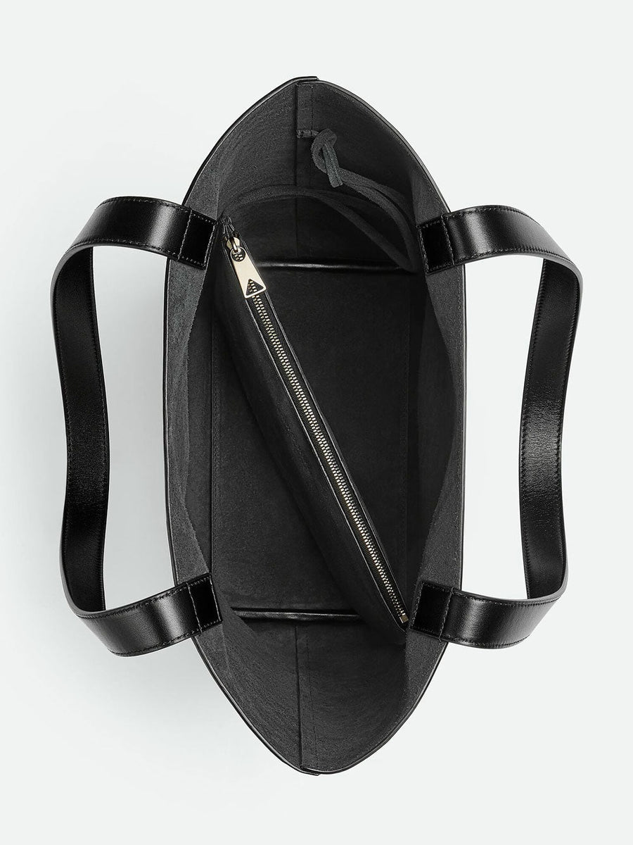 Close-up of Bottega Veneta cross body bags hardware and fine stitching