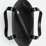 Close-up of Bottega Veneta cross body bags hardware and fine stitching