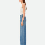 Close-up of Bottega Veneta pants hardware and fine stitching
