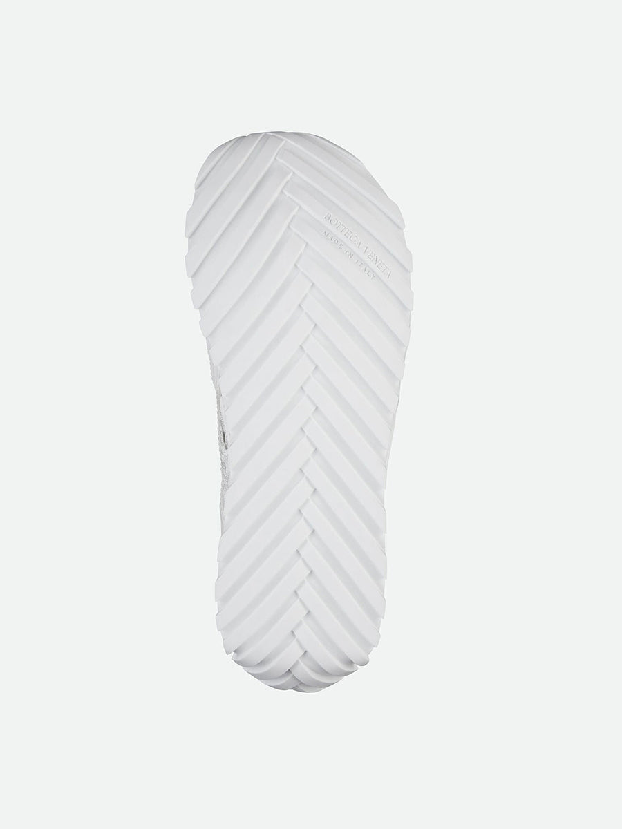 Close-up of Bottega Veneta flats hardware and fine stitching