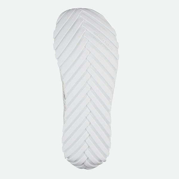 Close-up of Bottega Veneta flats hardware and fine stitching