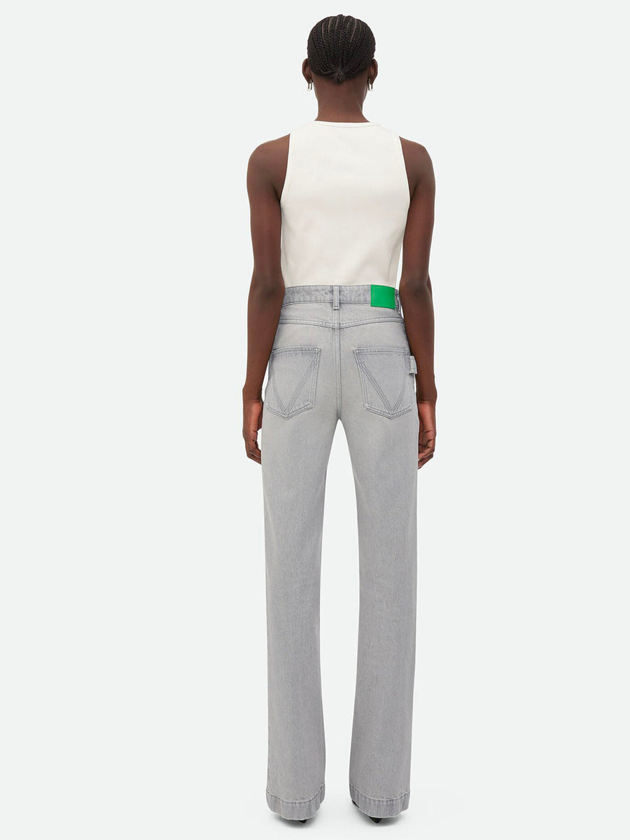 Close-up of Bottega Veneta pants hardware and fine stitching