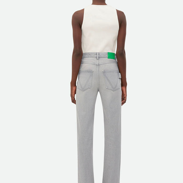 Close-up of Bottega Veneta pants hardware and fine stitching