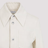Close-up of Bottega Veneta jackets hardware and fine stitching