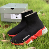 Balenciaga Red Chelsea Boots - Close-Up Texture View