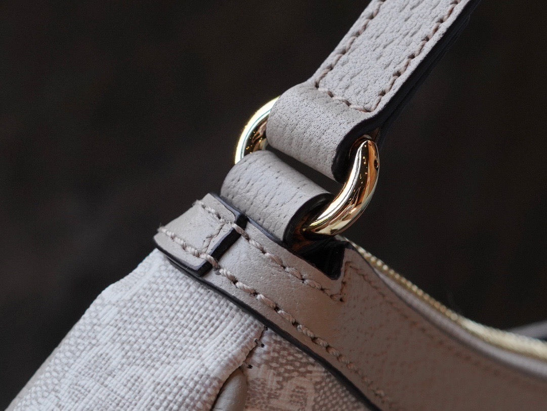 Side profile of Gucci Fashion Item showcasing structured silhouette