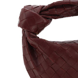 Close-up of Bottega Veneta shoulder bags hardware and fine stitching