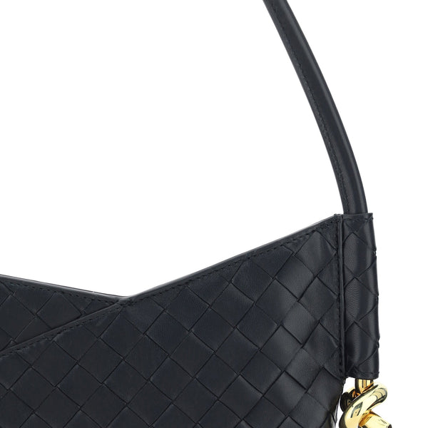Close-up of Bottega Veneta shoulder bags hardware and fine stitching