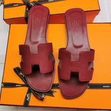 Hermes sandals Style 026 - close-up of iconic logo design