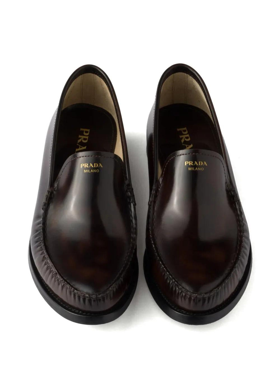 Close-up of Prada moccasins hardware and fine stitching