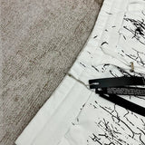 Close-up detail view of Amiri luxury piece style No.078