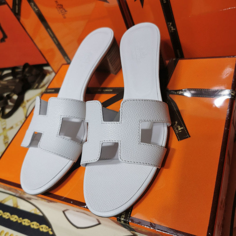 Hermes sandals Style 014 - close-up of iconic logo design