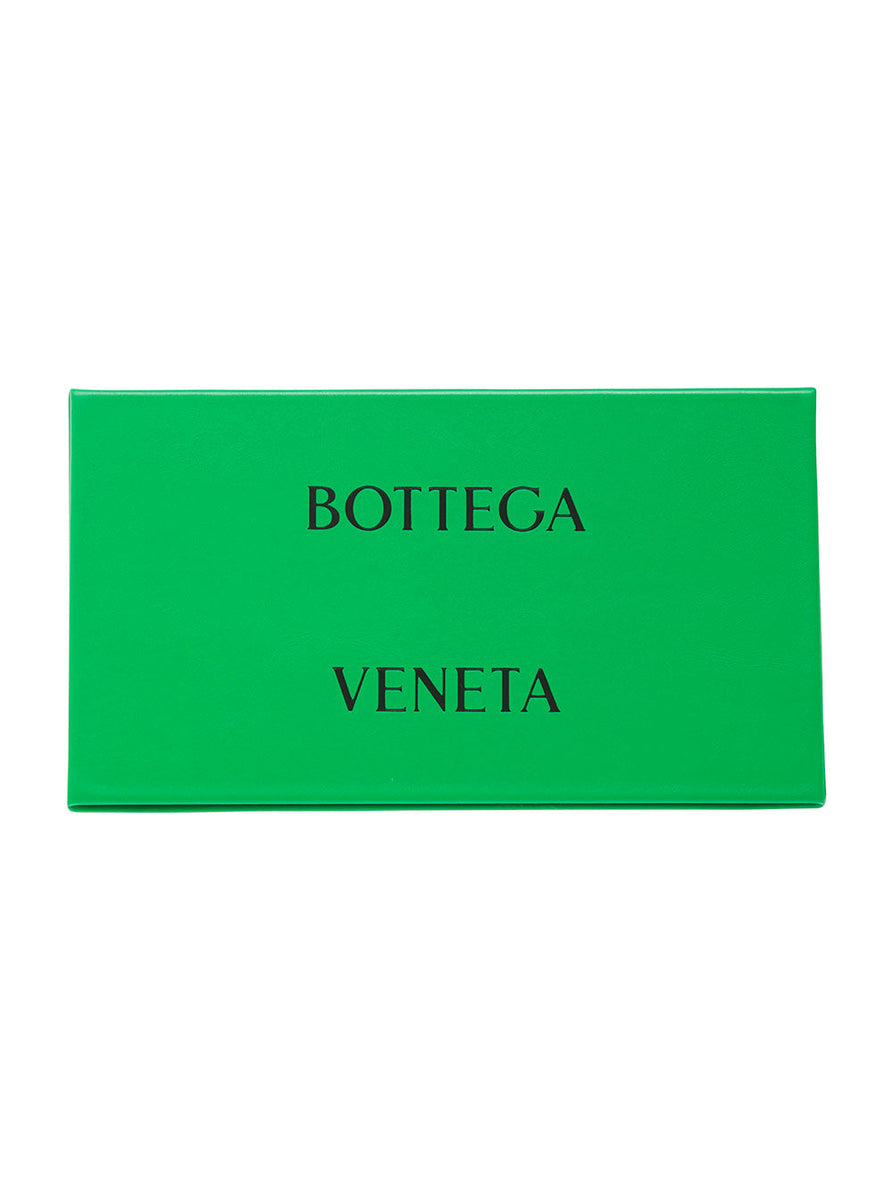 Close-up of Bottega Veneta sunglasses hardware and fine stitching