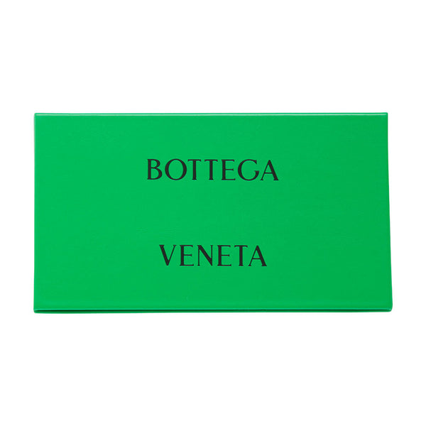Close-up of Bottega Veneta sunglasses hardware and fine stitching