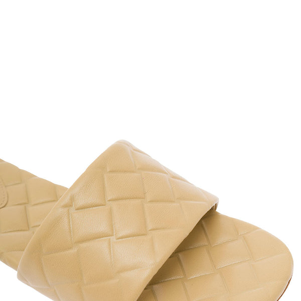 Close-up of Bottega Veneta flats hardware and fine stitching