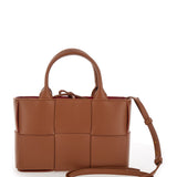 Close-up of Bottega Veneta shoulder bags hardware and fine stitching