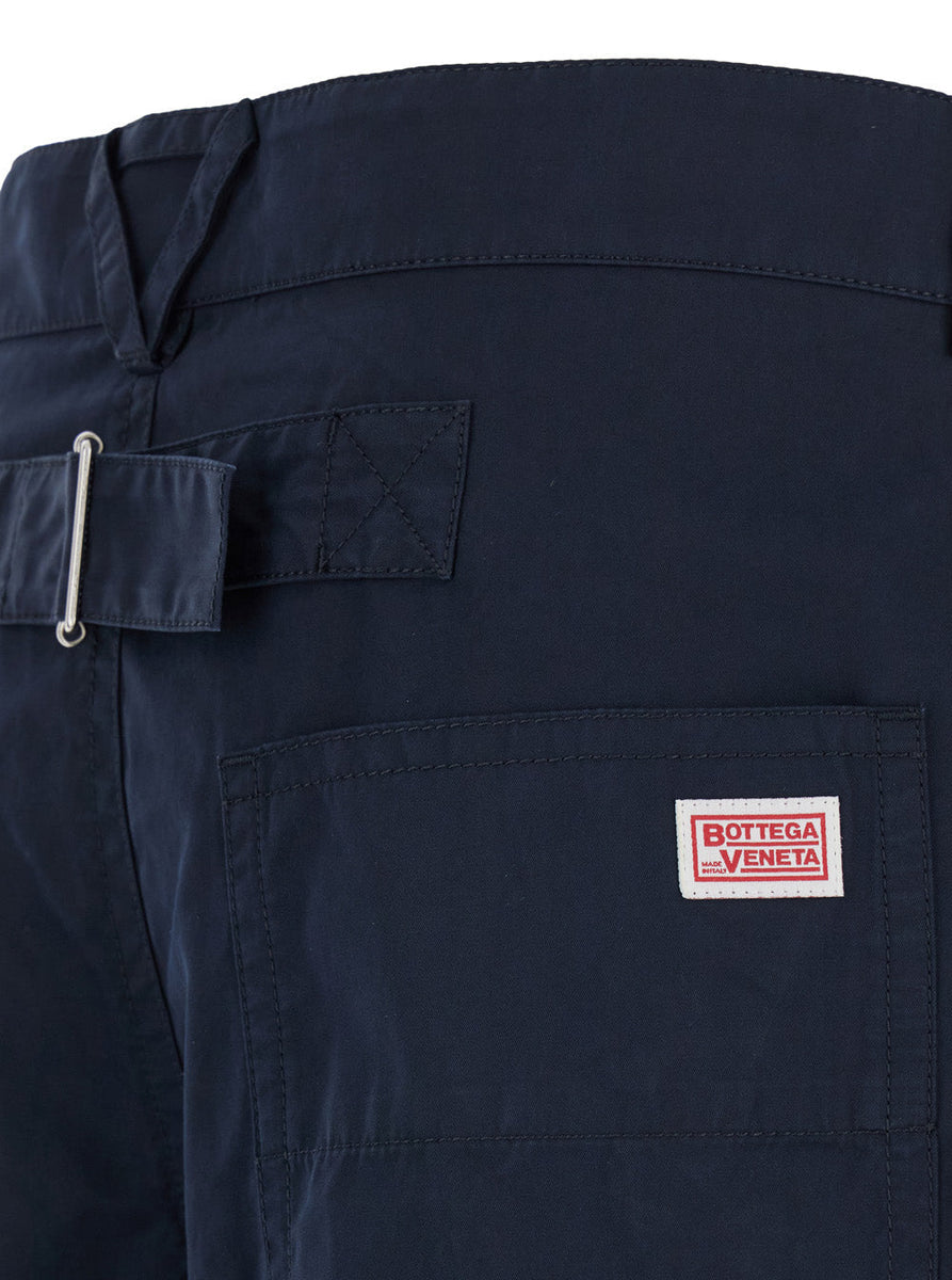Close-up of Bottega Veneta pants hardware and fine stitching