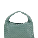 Close-up of Bottega Veneta shoulder bags hardware and fine stitching
