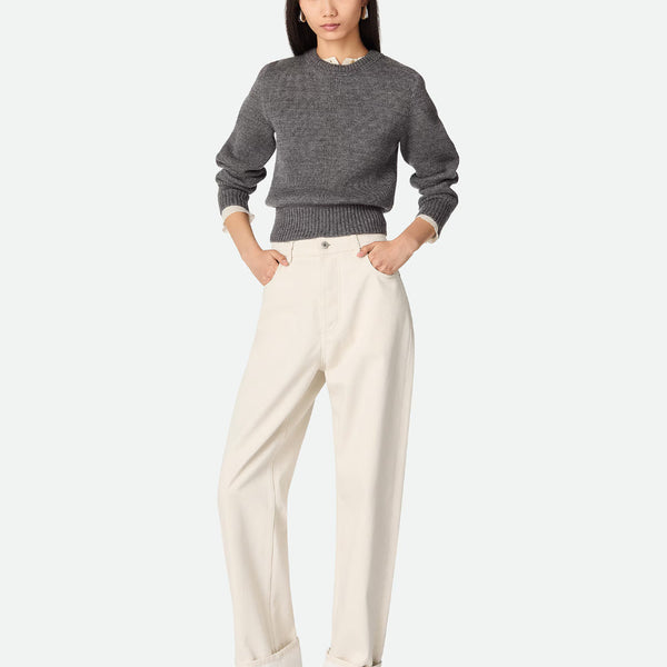 Close-up of Bottega Veneta pants hardware and fine stitching