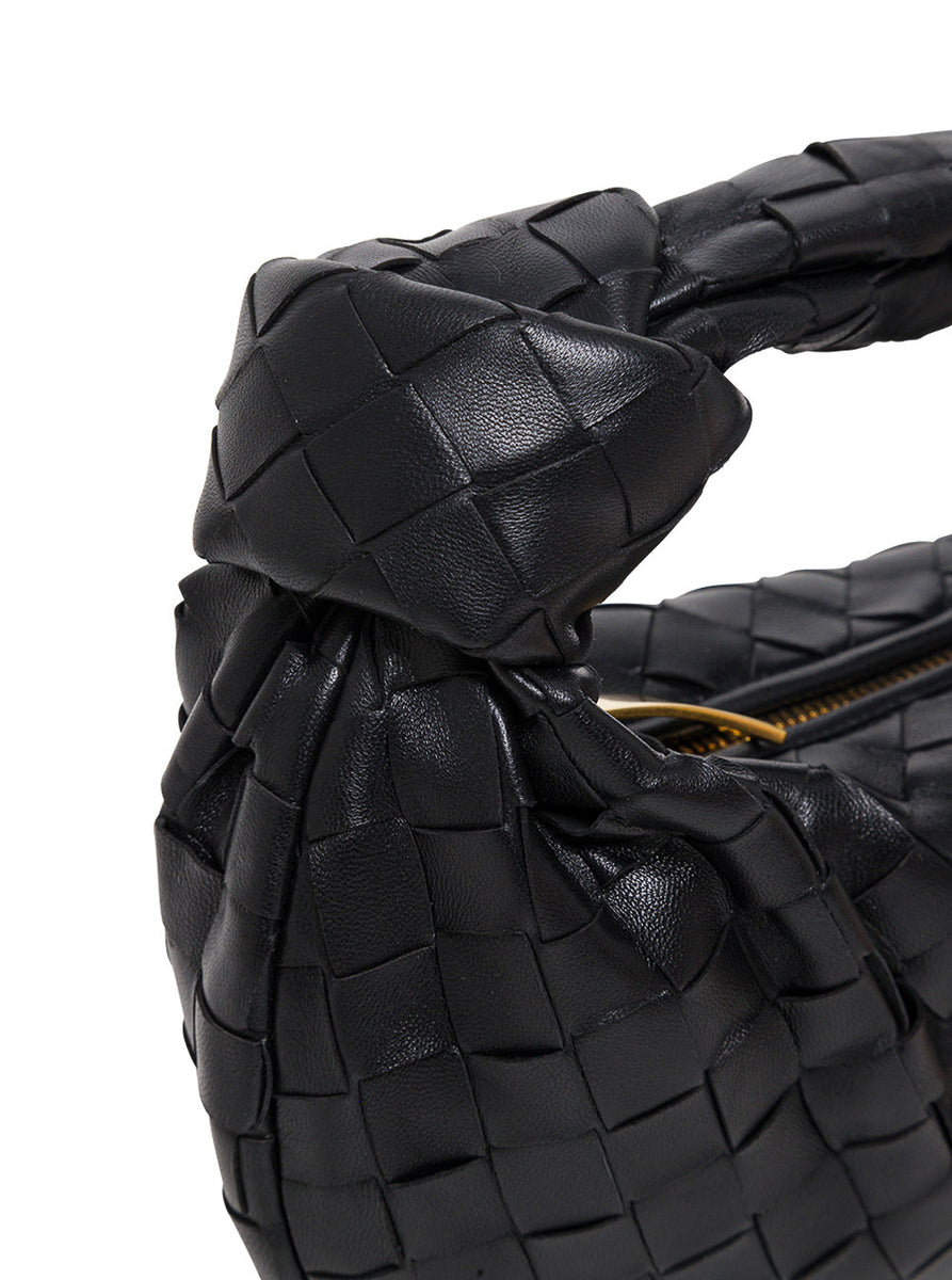 Close-up of Bottega Veneta shoulder bags hardware and fine stitching