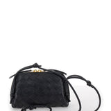 Close-up of Bottega Veneta cross body bags hardware and fine stitching