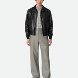 Close-up of Bottega Veneta coats hardware and fine stitching