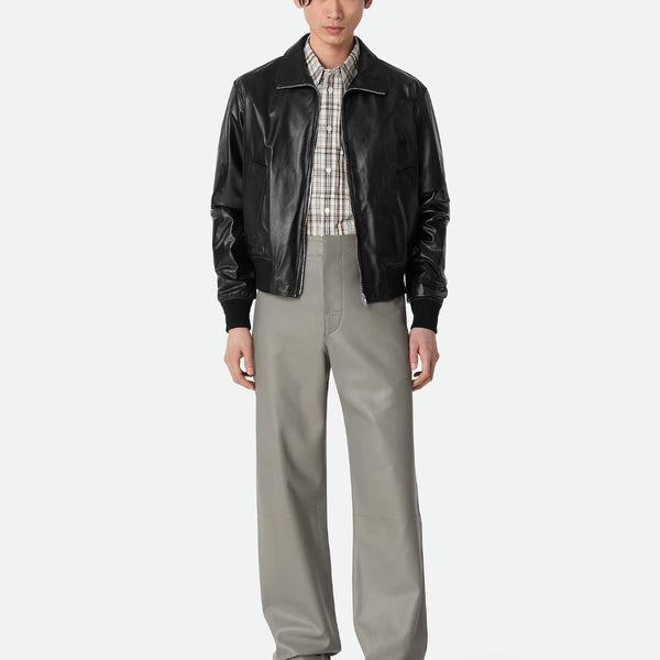 Close-up of Bottega Veneta coats hardware and fine stitching